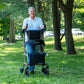 Senior using Upwalker Premium Lite Backsaver Upright Walker outdoors
